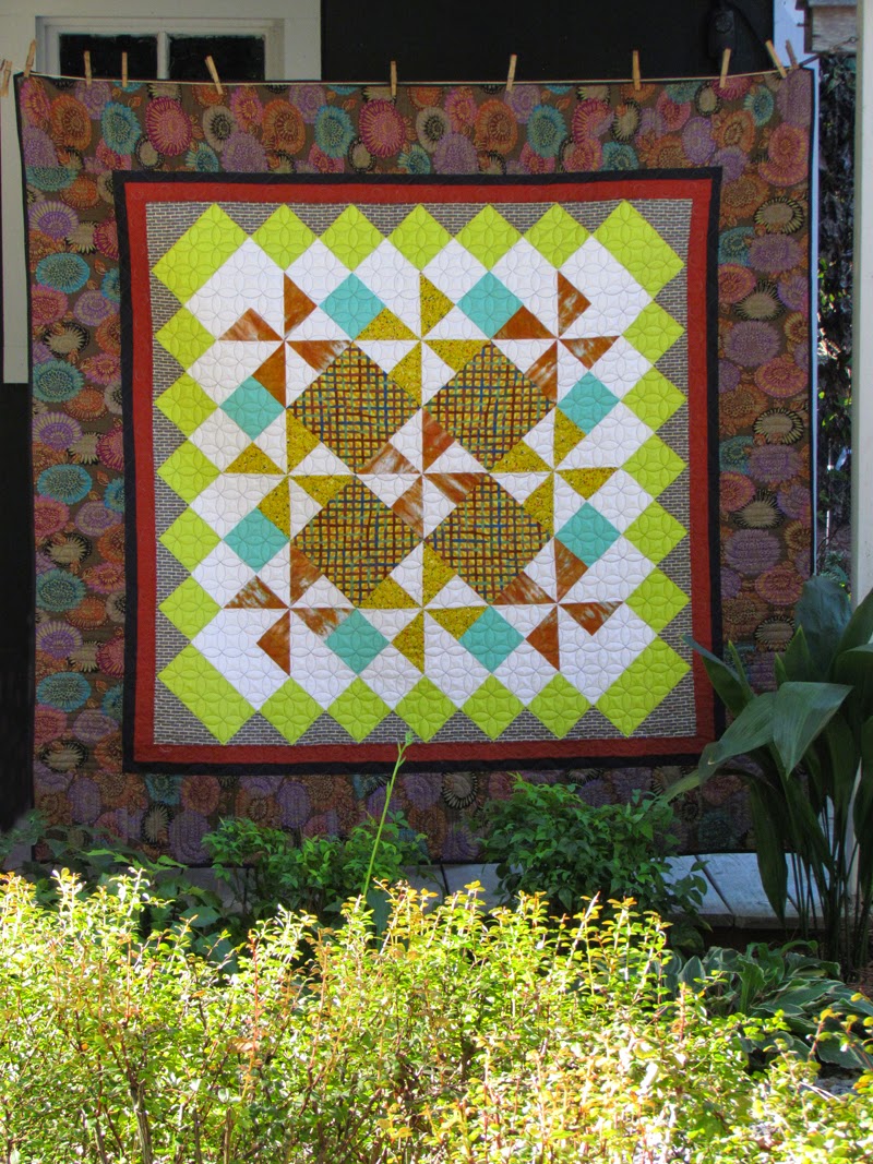 A quilt by Marty Mason.....It's hip to be square.