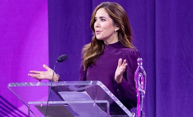 Crown Princess Mary wore a burgundy, purple silk top and burgundy purple wool midi skirt