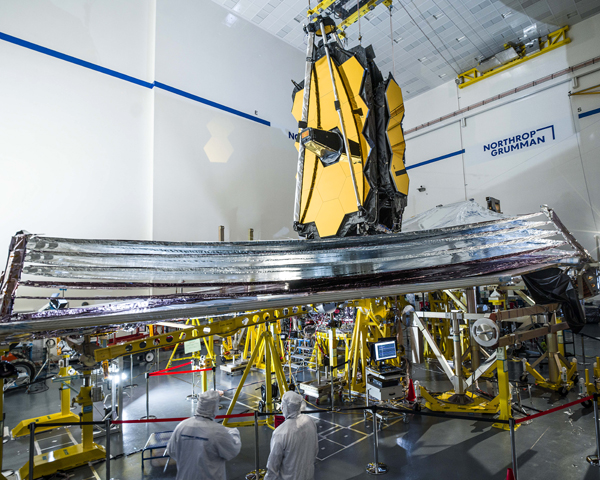 Technicians watch as NASA's James Webb Space Telescope unfurls its sunshield during a final pre-launch test at the Northrop Grumman facility in Redondo Beach, California. Technicians watch as NASA's James Webb Space Telescope unfurls its sunshield during a final pre-launch test at the Northrop Grumman facility in Redondo Beach, California.
