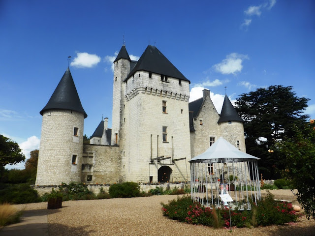 facade of Chateau du Rivau under a blue sky