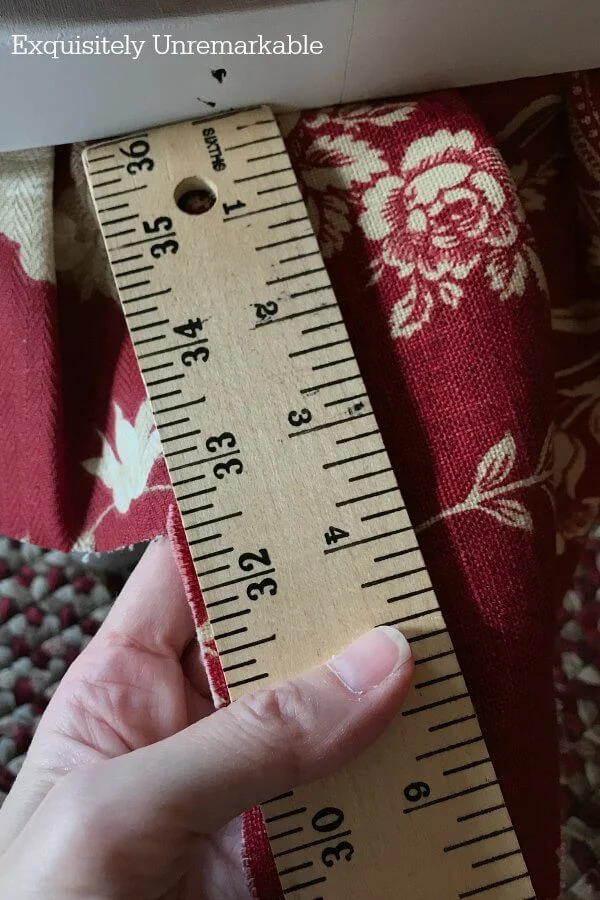 Measuring fabric skirt with a yardstick