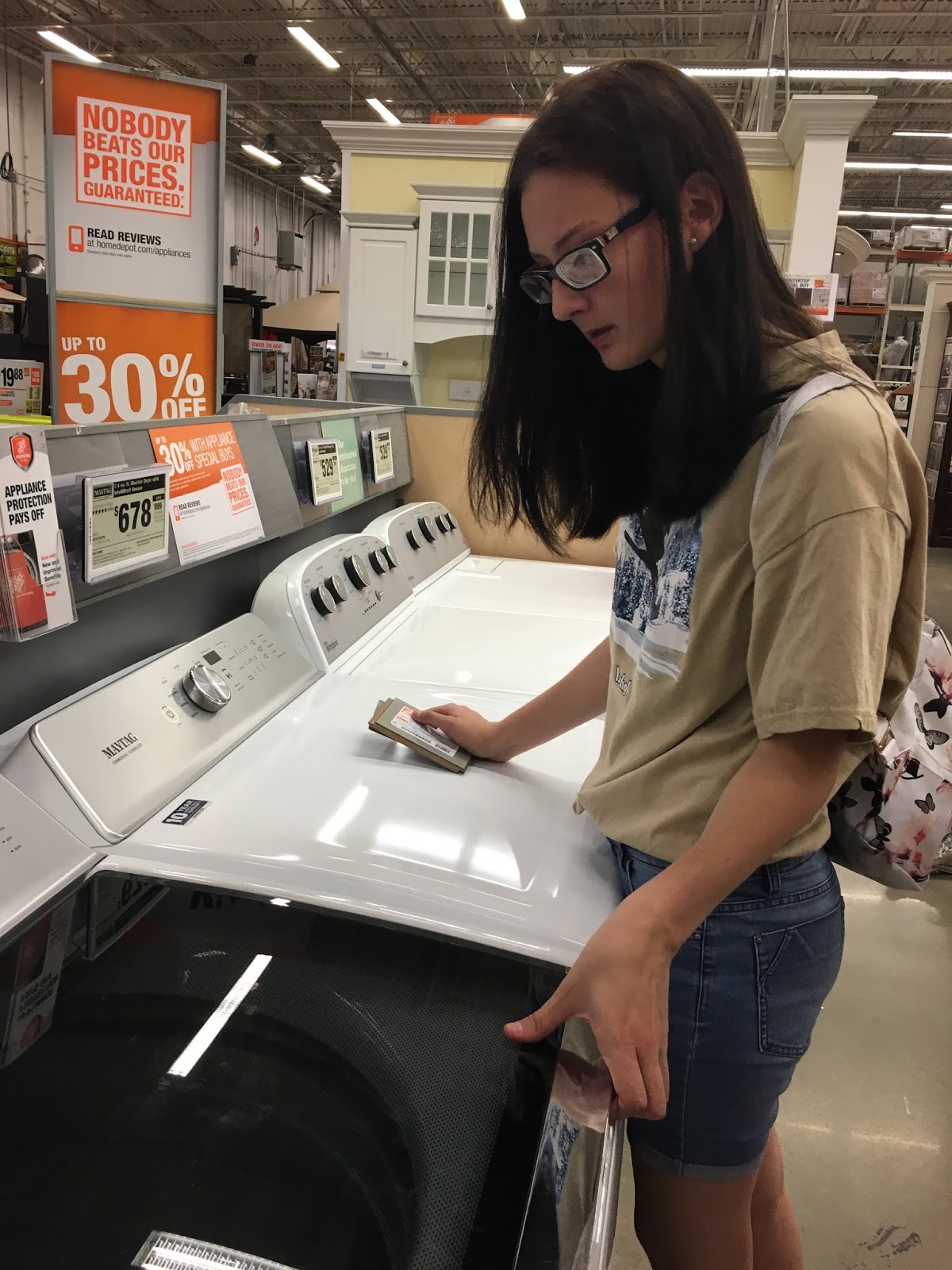 A female student explores a washing machine