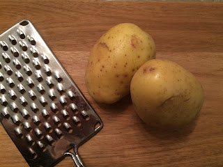 grater and two potatoes
