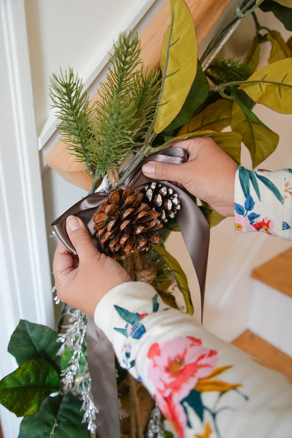 how to hang garland on stairs, stairway garland, garland on stair banister