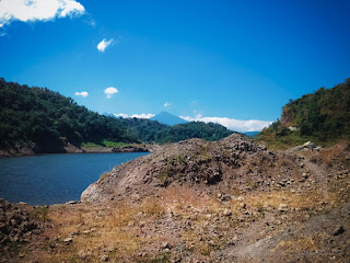 Dry Soil And Ground Rocks Of Lake Water Dam Between The Hills On A Sunny Day In The Dry Season Titab Ularan North Bali Indonesia