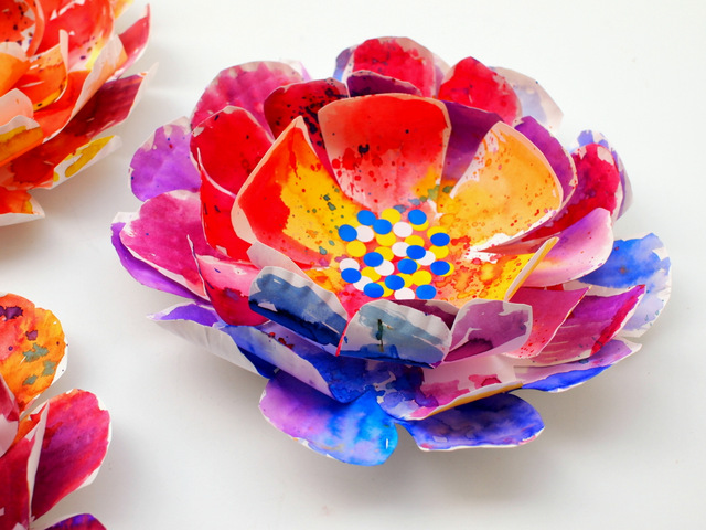 Create the middle of your paper plate flower with  circle stickers