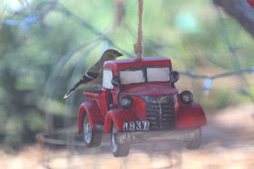 Red truck bird feeder - photo by Janice East / GypsyFarmGirl