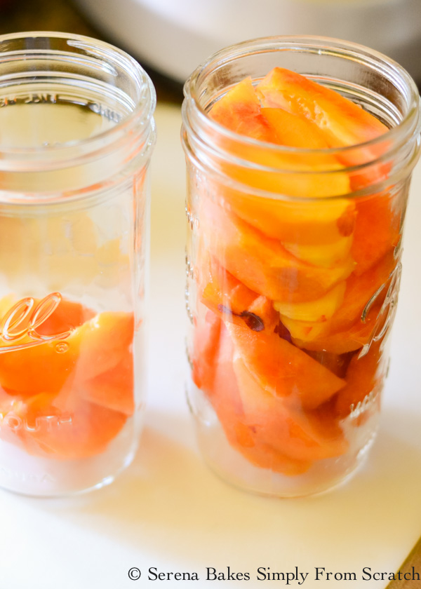 Fill jars with peel pitted peaches from Serena Bakes Simply From Scratch to make Whisky Peaches.