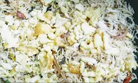 Mixing scrambled eggs with rice for cauliflower Manchurian fried rice recipe