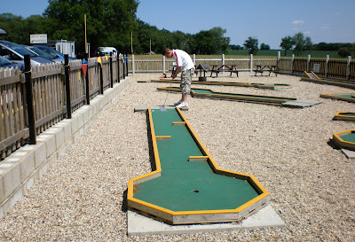 Playing on the Minigolf course at Blake End Craft Centre near Braintree Playing on the Minigolf course at Blake End Craft Centre near Braintree