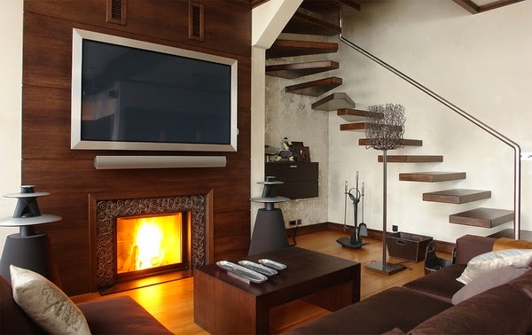 Living room with tv above fireplace