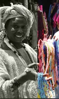 Trading beads at a local market in Senegal speaking Wolof