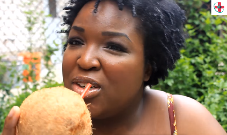 Woman drinking coconut water