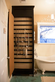 Organize jewelry to hide an unsightly water heater :: OrganizingMadeFun.com