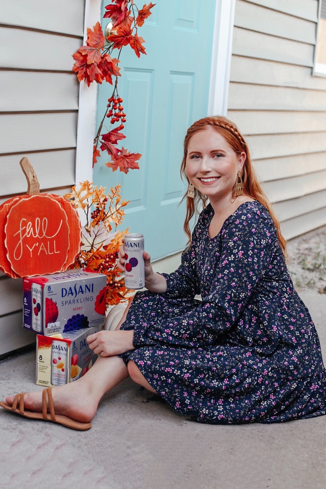 Fall Porch Decorating with Dasani Sparkling Water. Tampa Blogger, Amanda Burrows, Affordable by Amanda shares her fall porch decoring leaves and white pumpkins. She is also drinking Dasani Sparkling Berry sparkling water while she decors the front porch for fall. 