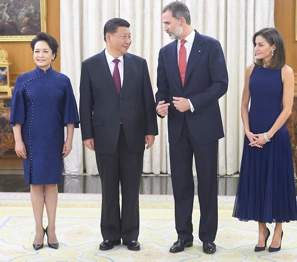 Queen Letizia wore Felipe Varela skirt and top and Nina Ricci pumps. Peng Liyuan. Queen Victoria Eugenia's Cartier diamond earrings