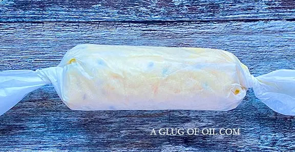 Flavoured butter rolled in greaseproof paper