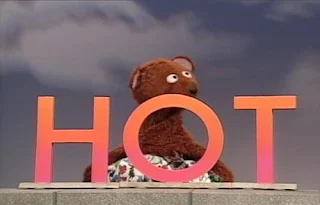 Baby Bear demonstrates the word Hot. Sesame Street Elmo's Magic Cookbook