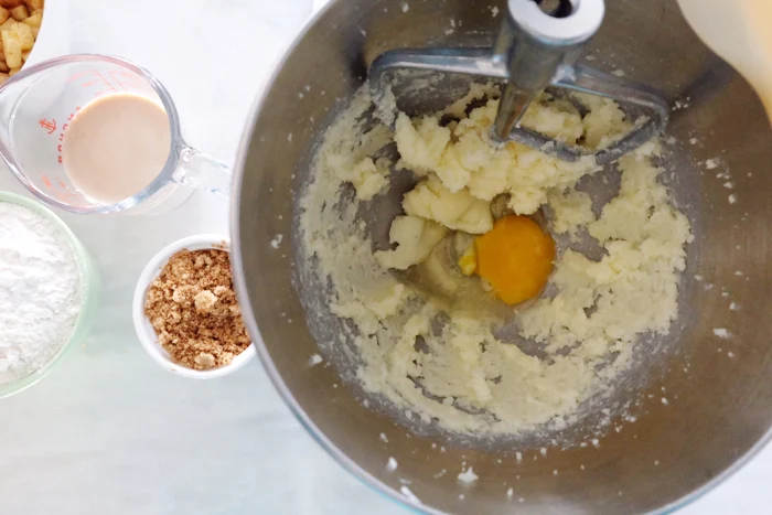 adding egg to creamed butter and sugar