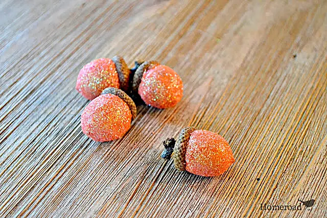 glittered orange acorns