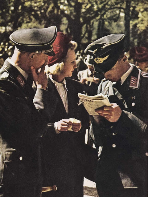 German officers talking to a blonde lady.