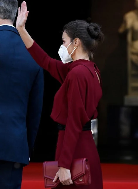 Queen Letizia wore a limited edition burgundy red open back dress from Massimo Dutti