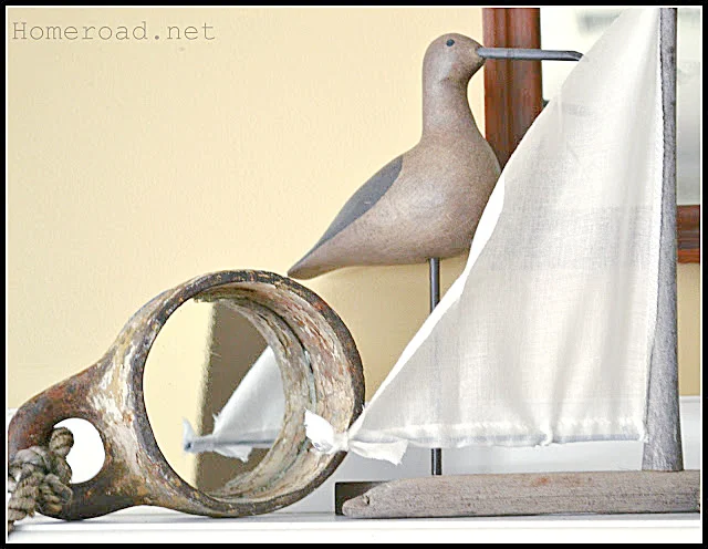 mirror, bird and driftwood sailboat