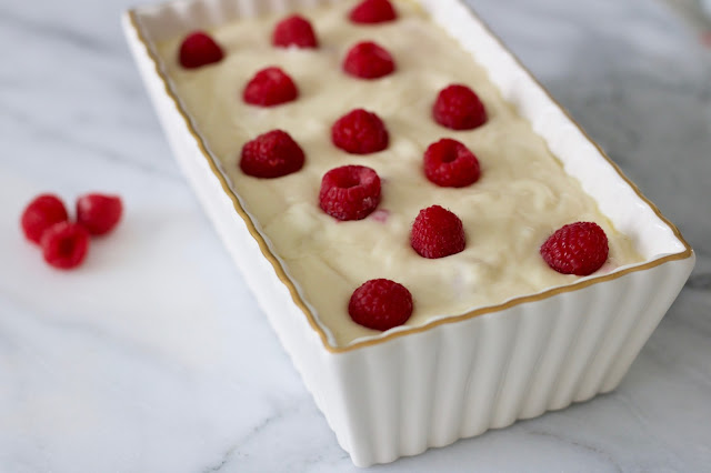 pre-cooked raspberry lemon loaf in a pretty white and gold loaf pan