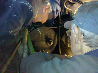 Brian & Ronnie repairing an air leak on the Husky