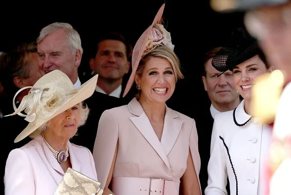 The Duchess is wearing Catherine Walker. Queen Maxima is wearing Claes Iversen. Queen Letizia wore a printed midi dress by Cherubina