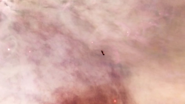 UFO evidence inside of the Orion's Nebula in deep space photographed by the Hubble Telescope.