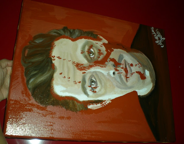 portrait d'un homme dont le visage est taché avec du rouge de Venise