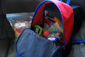 backpack filled with toys to keep kids entertained