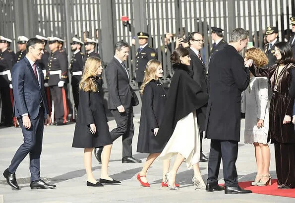 Queen Letizia, Princess Leonor and Infanta Sofía attended the Solemn opening of the Spanish Parliament. Carolina Herrera cape and dress