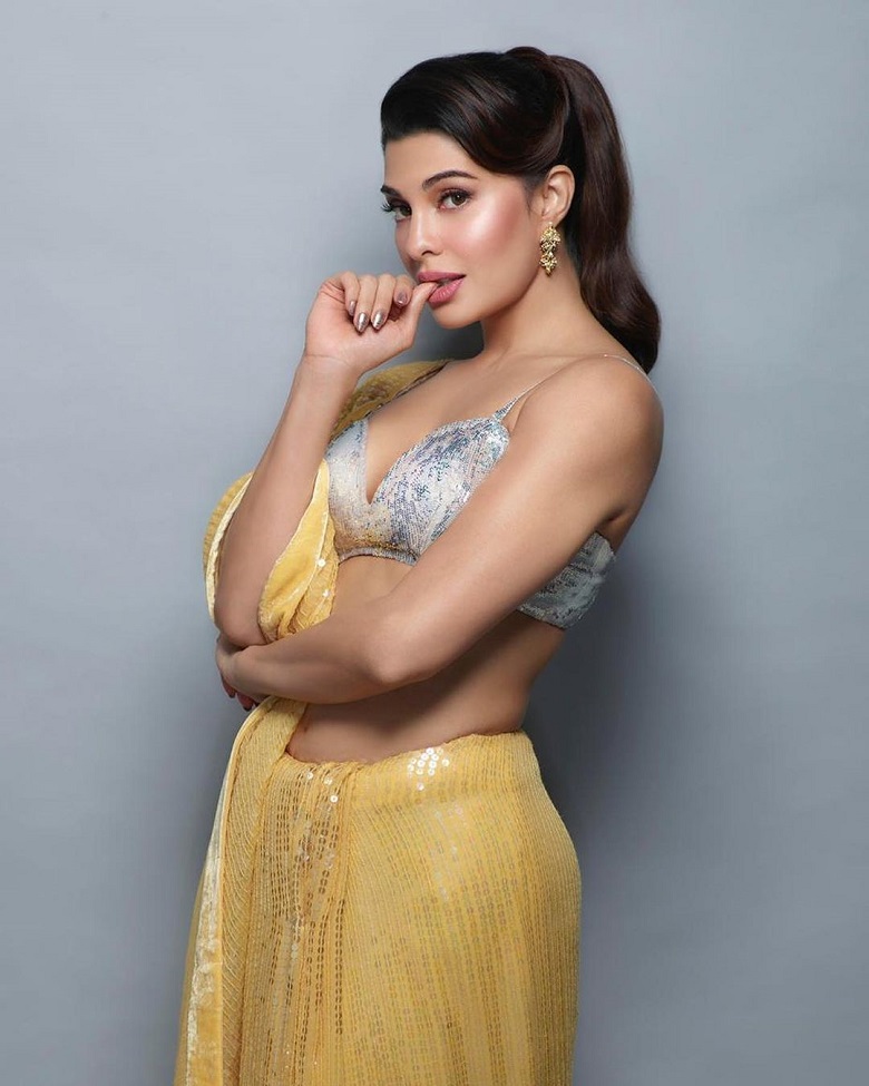 Image result for Jacqueline Fernandez in yellow sequined saree