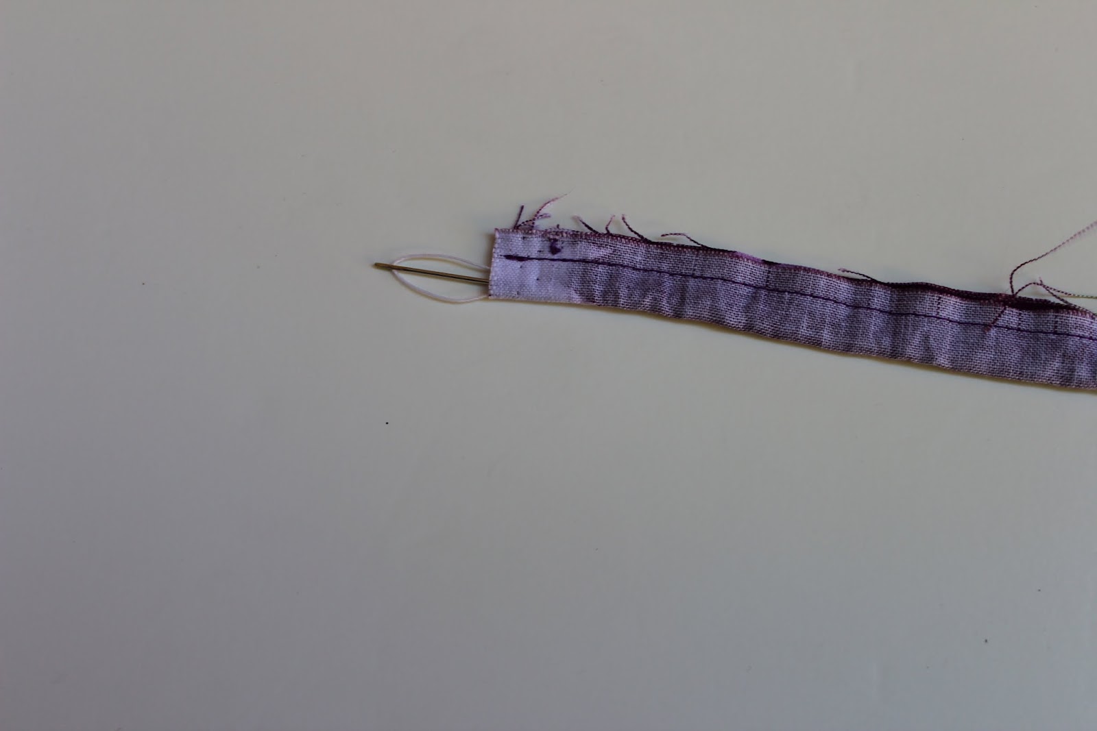 pull the needle out from other end