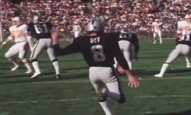 Ray guy with Raiders kicking the ball in NFL Super Bowl game