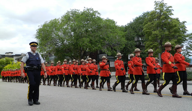 the RCMP continues down the street dressed in formal wear