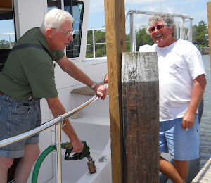 Fred and Richard chat while the diesel runs quickly thru our new adapter.  Dog River, AL