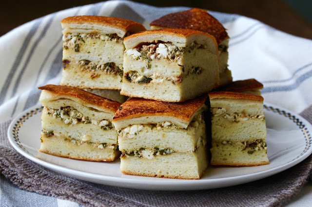 Tootmanik s Gotovo Testo is a Bulgarian cheese bread. Several layers of bread dough are brushed with butter and spread with feta cheese along with herbs, and then baked into savory and delicious stacks of deliciousness.