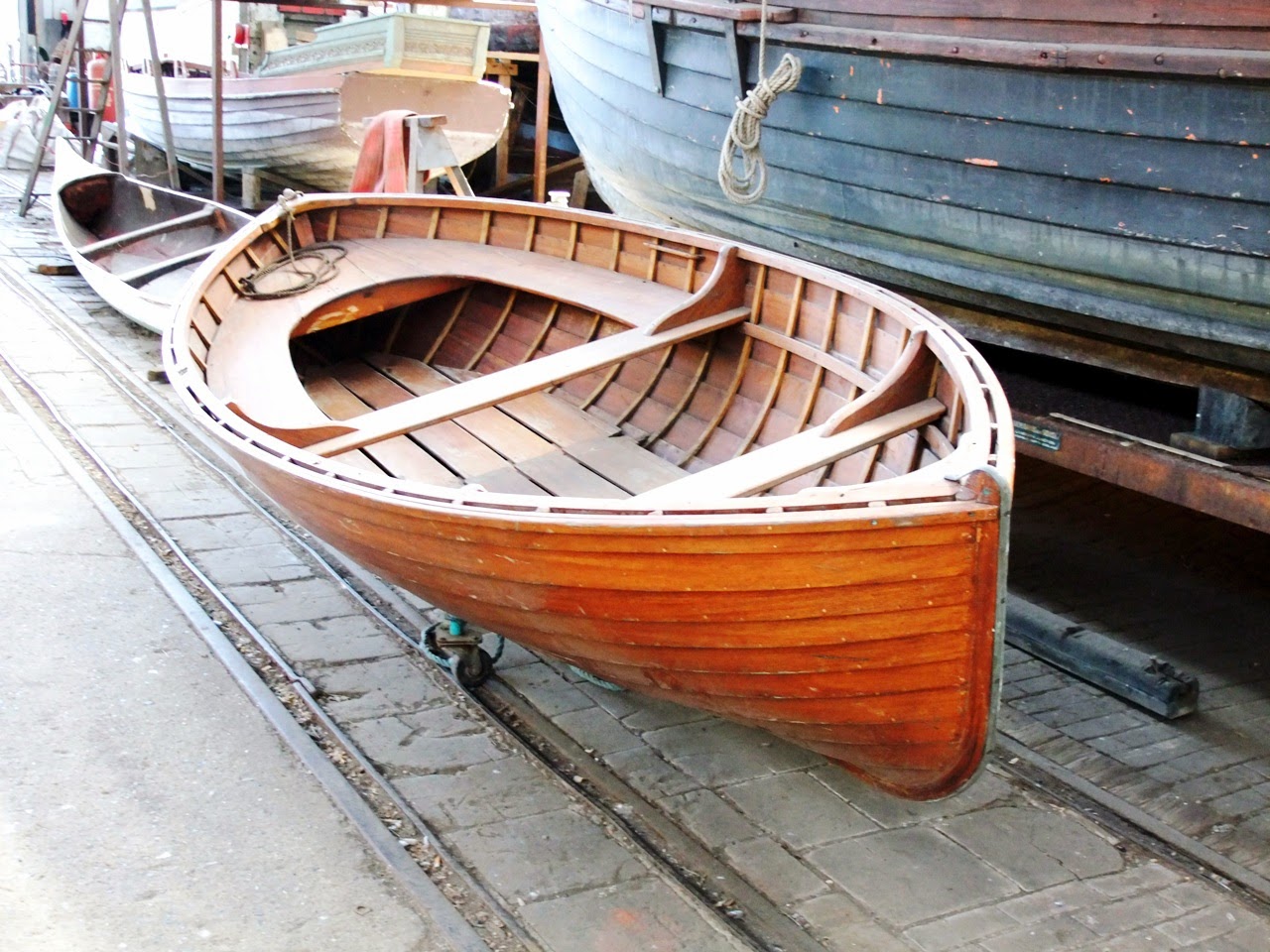 A small wooden boat is called