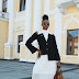 Stylish ways to wear a black cold shoulder blazer and white pleated skirt suit.