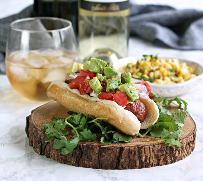 Recipe for a loaded hot dog sandwich with Latin flavors and a roasted corn.