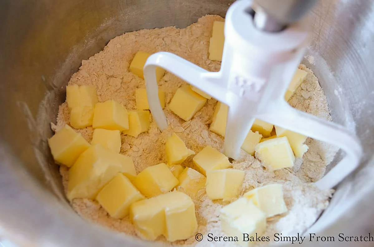 Butter added to flour mixture in a mixing bowl for Crumb Crust.