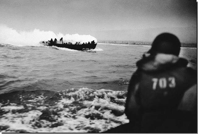 German machine gun fire hits  grenade explodes  landing craft