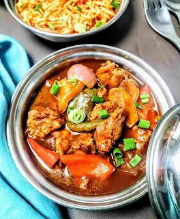 Serving chilli chicken gravy with fried rice