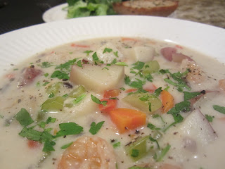 Seafood chowder being served in a soup bowl