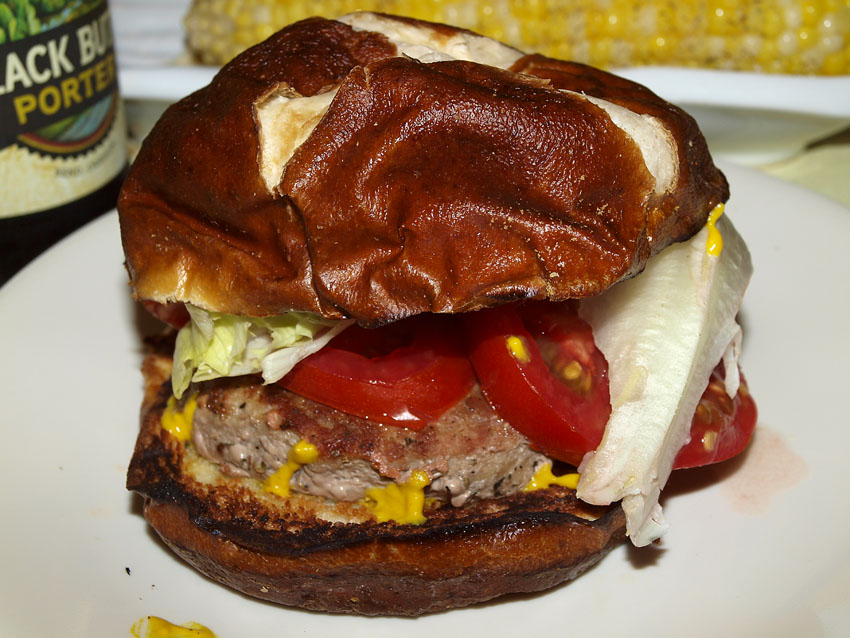 Pellet Smoker Cooking Turkey Burgers on Pretzel Buns and Corn on the Cob