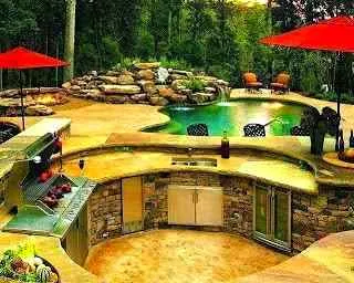 Backyard paradise with outdoor kitchen and swimming pool.
