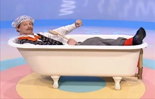 Mr Noodle puts a bonnet on his head and gets into the bathtub without taking off his clothes. Sesame Street Elmo's World Bath Time The Noodle Family